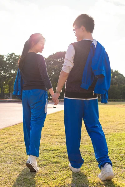Asian couple walking together