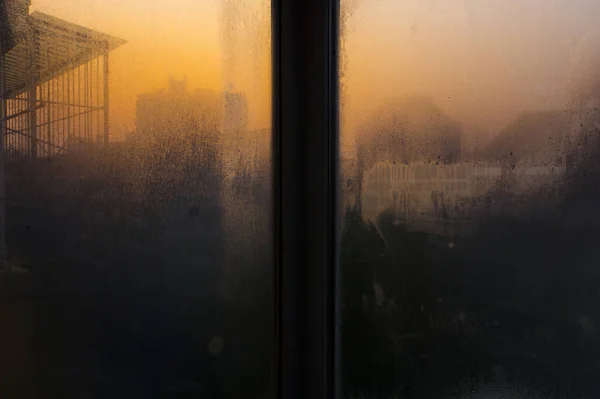 window with fog and sky.