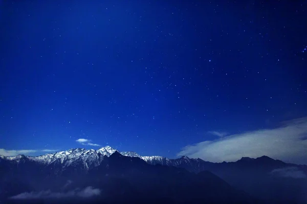 milky mountains in the night sky
