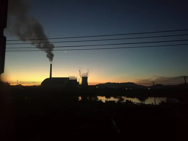 industrial factory with smoke