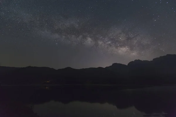 milky sky with clouds and stars