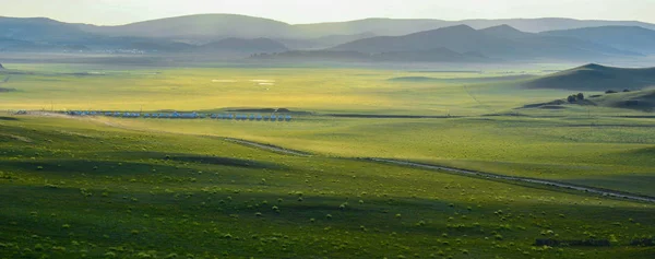 landscape with green sky and clouds