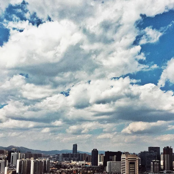 new york city skyline with clouds