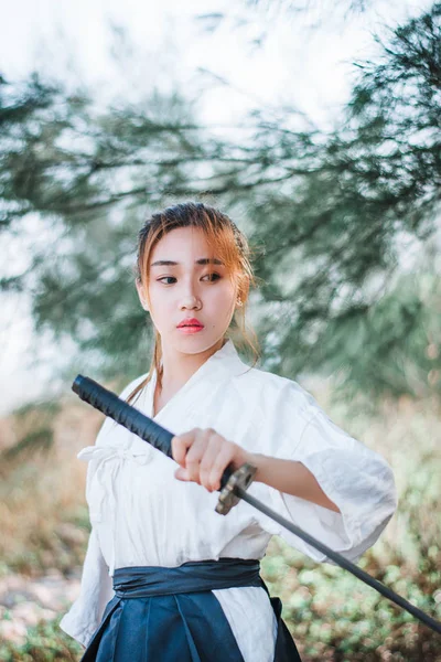 Asian woman holding the sword