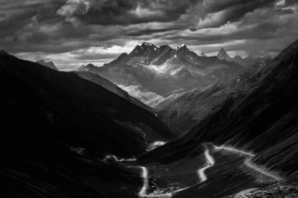 black and white clouds in the mountains