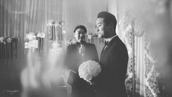 Black and white photo of couple during wedding