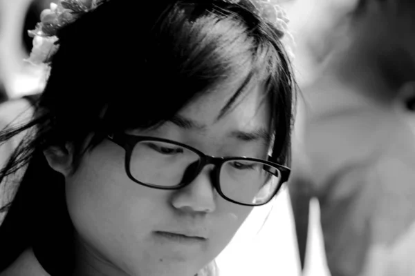 black and white portrait of young asian girl at daytime