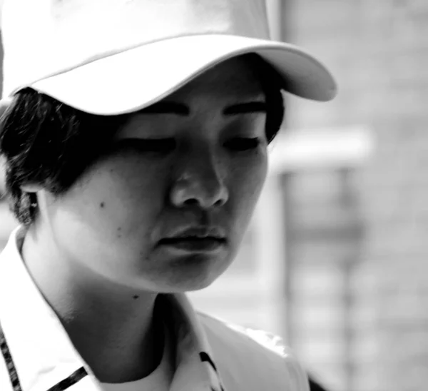 black and white portrait of young asian woman at daytime