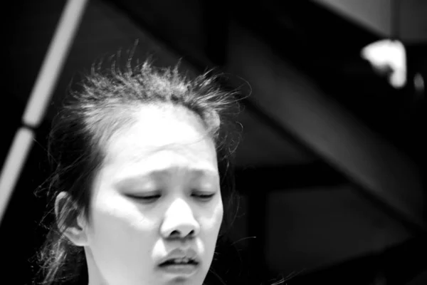 black and white portrait of young asian woman at daytime