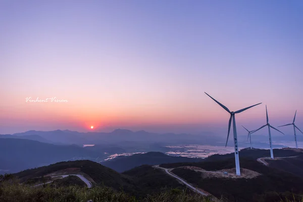 wind turbines at sunset in the mountains