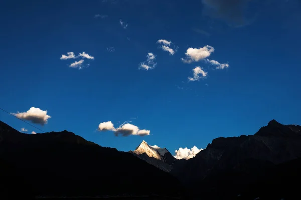 the moon in the mountains.