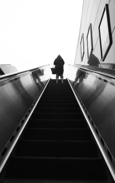 man and woman walking down the stairs