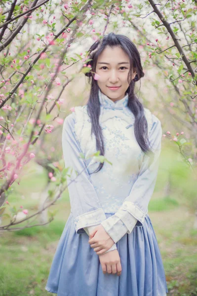 Asian woman posing in spring flowers