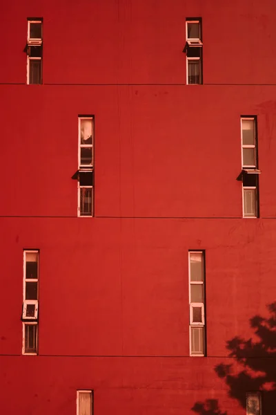 red wall with windows and balconies