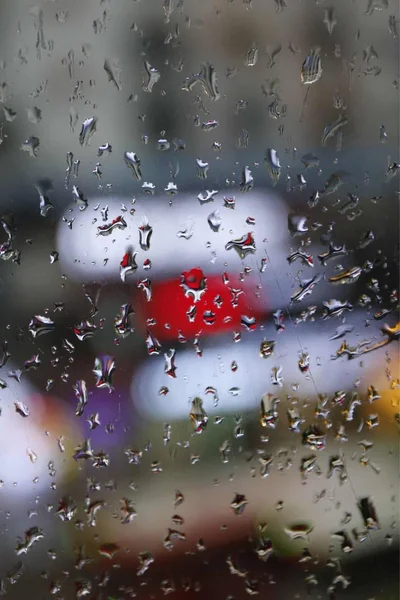 rain drops on glass, wet window and rainy weather