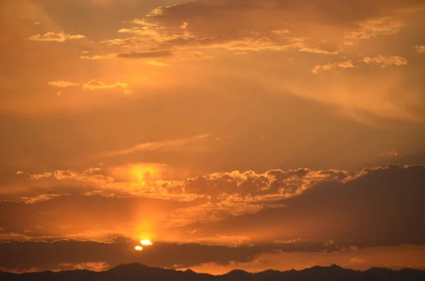 sunset in the sky with clouds