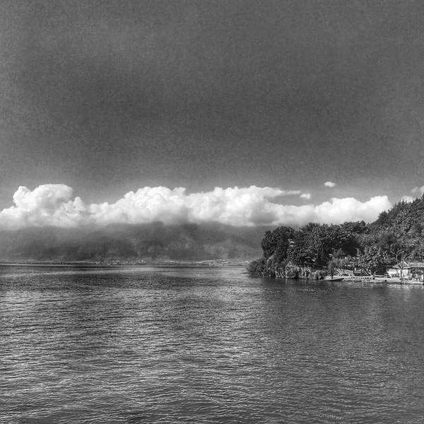 black and white clouds over the sea