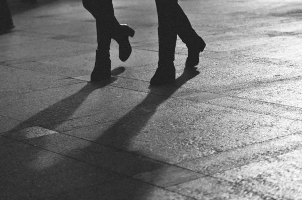 Silhouette of people walking on street