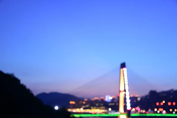 blurred city skyline at night