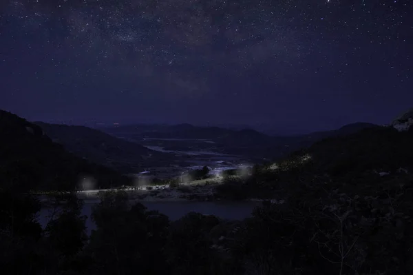 night landscape with mountains and stars