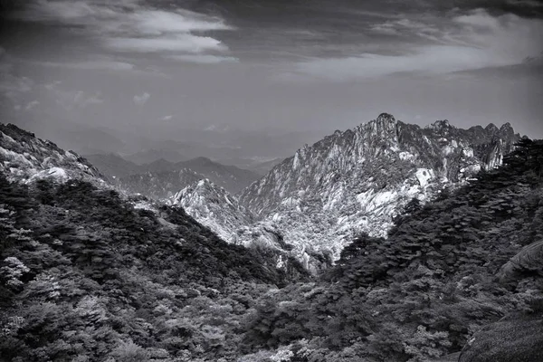 black and white mountain landscape with snow