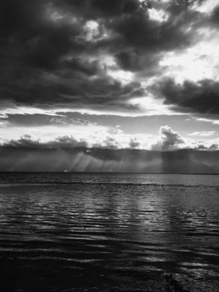 black and white clouds in the sea
