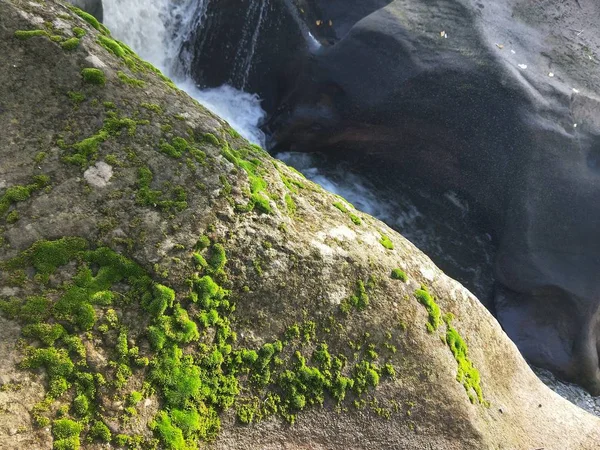 waterfall and rocks in the mountains