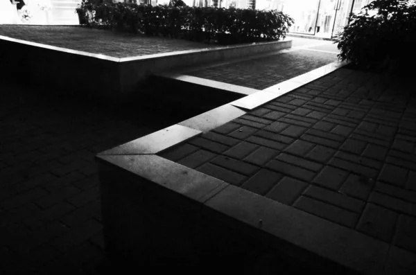 black and white photo of street scene