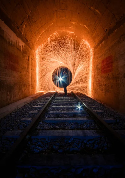 underground tunnel with a large hole in the darkness