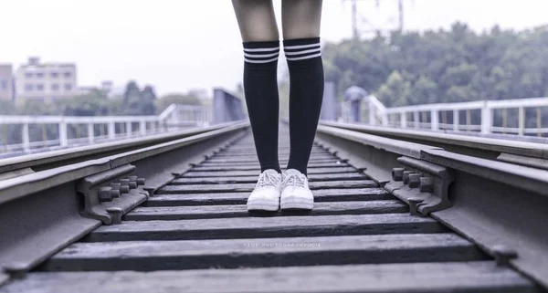 Asian teen girl on railway