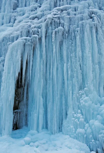 frozen waterfall in winter at day time