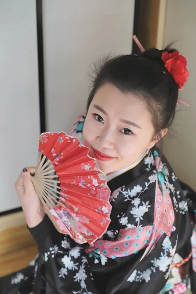 Beautiful Asian woman wearing kimono posing