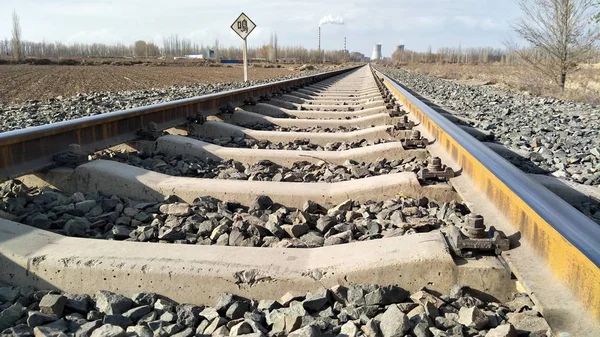 railroad tracks in the field
