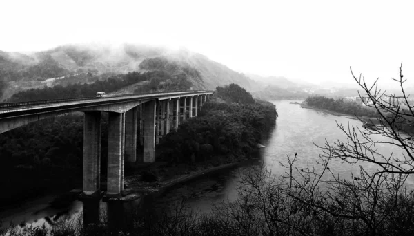 black and white bridge in the park