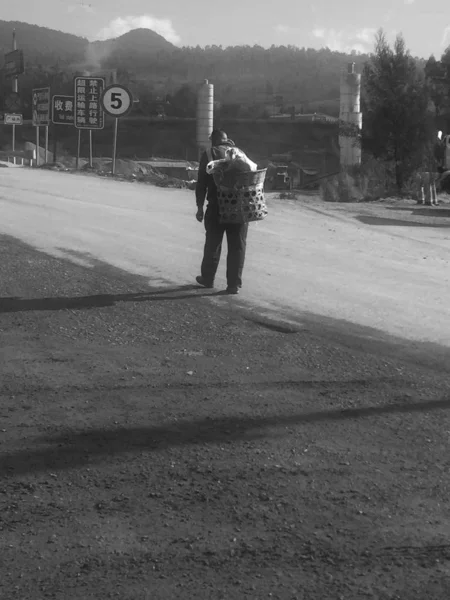 a man and a girl in a black t-shirt on a walk in the city
