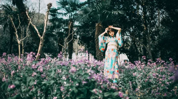 young asian woman in Cherry Blossom garden