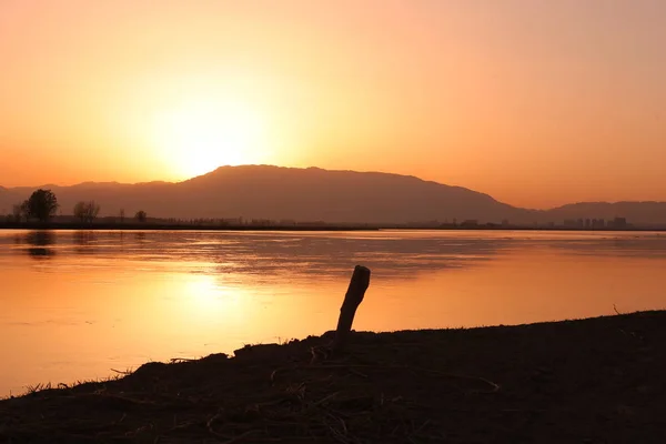 stock image sunset on the lake.