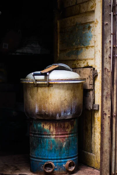 stock image old rusty metal barrel on the wooden table