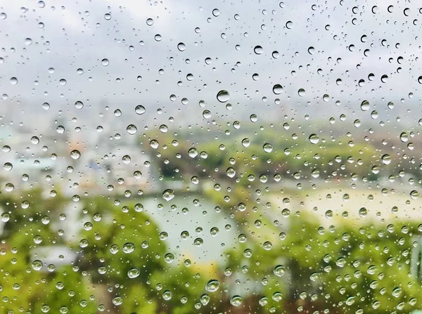 glass window with rain drops, weather