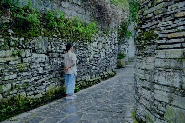 young man walking on the street in the old town