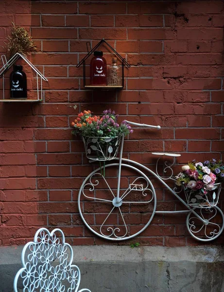 red brick wall with a tree