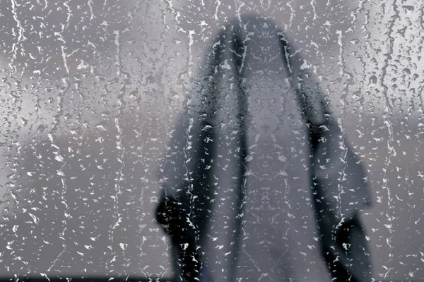 rain drops on glass, wet window and rainy weather