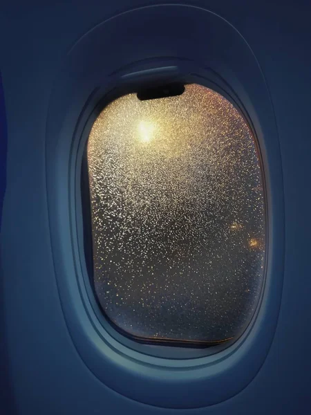 airplane window in the night