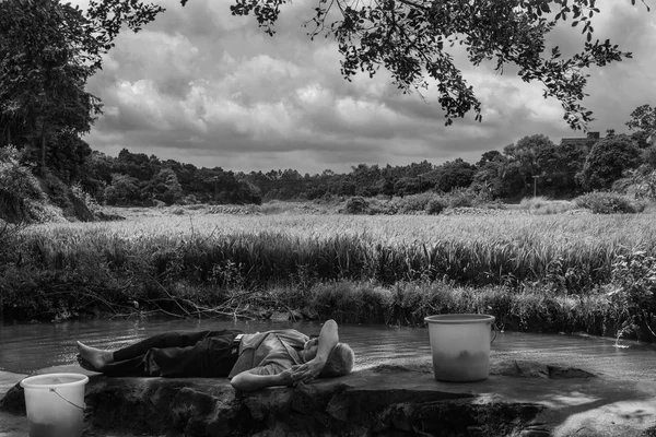 man in a boat on a lake in the morning