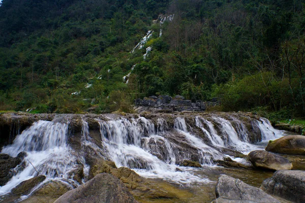 waterfall and rocks in the mountains
