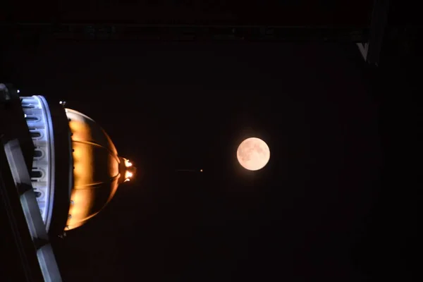 close up of a projector lens on a black background