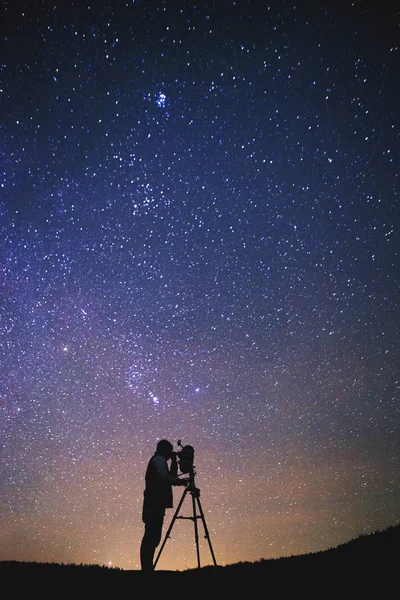 astronomy nebula night sky and man with telescope