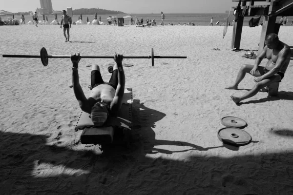 young man and woman on the beach