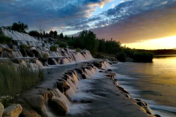 beautiful landscape with a waterfall in the background