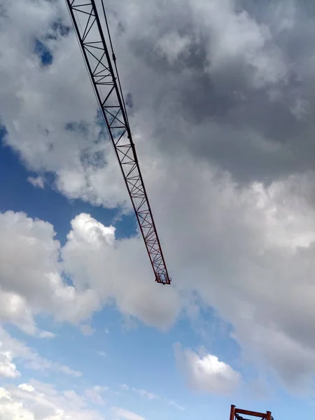 stock image construction crane and building site against blue sky